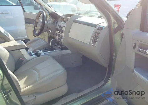 2009 Mercury Mariner V6 z USA, uszkodzony, nr VIN 4M2CU81GX9KJ06334